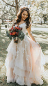 blush long sleeve wedding dress